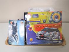 A tray containing three diecast military Giants of the Sky, Airfix Ford Focus rally car,
