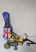 A mid 20th century tin plate tractor together with a Tonka Trencher and a Ashton union jack ukulele