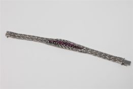 A fine quality ruby and diamond bracelet in 18ct white gold, 52g.