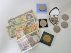 A box containing crowns, silver three pence pieces,