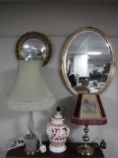 An oval gilt framed bevel edged mirror,