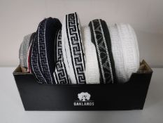 A box containing nine spools of vintage Silver Cross pram trim