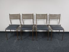 A set of nine metal framed stacking chairs