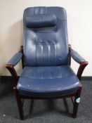 A stained beech framed blue leather upholstered armchair