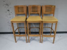 A set of three bar stools