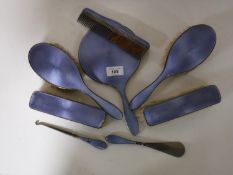 An eight piece silver and enamelled Art Deco dressing table set