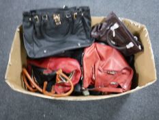 A box containing a quantity of lady's leather handbags