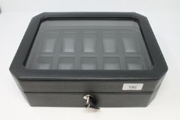 A gents faux leather watch display box with key,