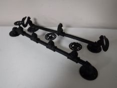 Two contemporary metal door racks