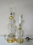 Two cut glass table lamps on brass bases