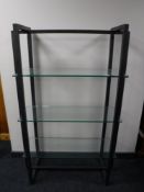 A set of contemporary metal three tier shelves