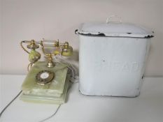 An onyx telephone together with an enamel bread bin