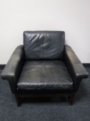 A mid twentieth century Danish black leather armchair