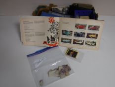 A box of assorted post cards, cigarette cards,