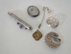 A Victorian silver swallow brooch, a Celtic silver brooch,