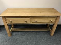 A reclaimed pine dresser base fitted with two drawers,