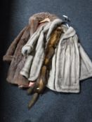 Two fur coats and a fox fur wrap