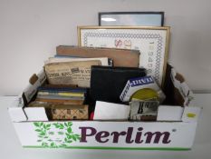 A box containing books, 20th century photographs,