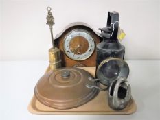 A tray containing oak mantel clock, copper bed warmer, railway lamp,
