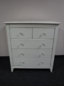 A painted pine five drawer chest