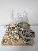 A tray containing two lead crystal whiskey decanters with stoppers with one other,