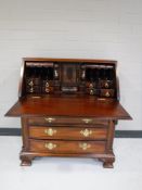 A child's Georgian style mahogany bureau