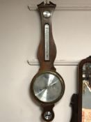 A mahogany cased barometer with silvered dial by Comitti