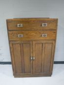 An oak linen chest fitted two drawers