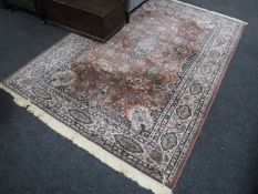 A Persian rug on pink ground,