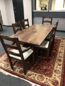 A contemporary hardwood dining table, length 183 cm,