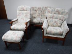 A four piece contemporary lounge suite comprising of two armchairs with a stool and a two seater