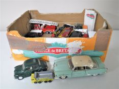 A box containing play-worn die cast vehicles