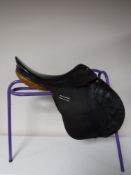 A Kirkland leather saddle on stand