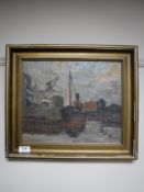 A gilt framed oil on canvas depicting a steam boat in a dock