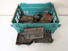 A box containing antique door locks and handles
