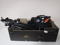A box containing assorted camera equipment including tripods, camera bag, Pentax digital camera,