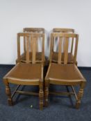 A set of four oak dining chairs
