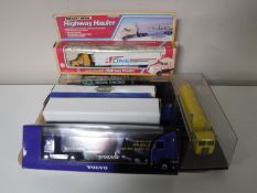 Seven boxed diecast trucks;