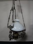 An antique rise and fall oil lamp with glass shade (converted)
