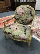 A continental gilded salon armchair with tapestry seat,