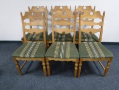 A set of six blonde oak dining chairs