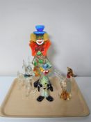 Two Murano glass clowns together with a glass bird and dog ornament