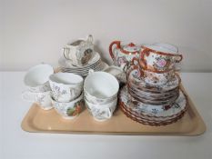 A tray containing a fourteen piece Japanese tea service together with an English china tea service