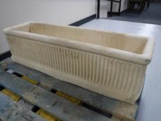 A composition garden trough