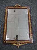 A mahogany and gilt framed bevel edged mirror with brass mounts