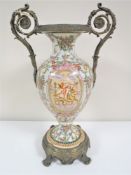A continental china vase with gilt metal handles and on gilt metal base,