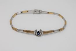 An 18ct white and yellow gold diamond and sapphire set bracelet,