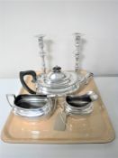 Two Georgian style silver plated candlesticks and a silver plated three-piece tea set