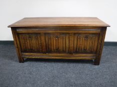 An oak linen fold blanket box