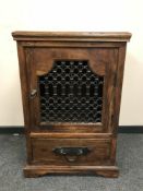 A contemporary hardwood single door cabinet,